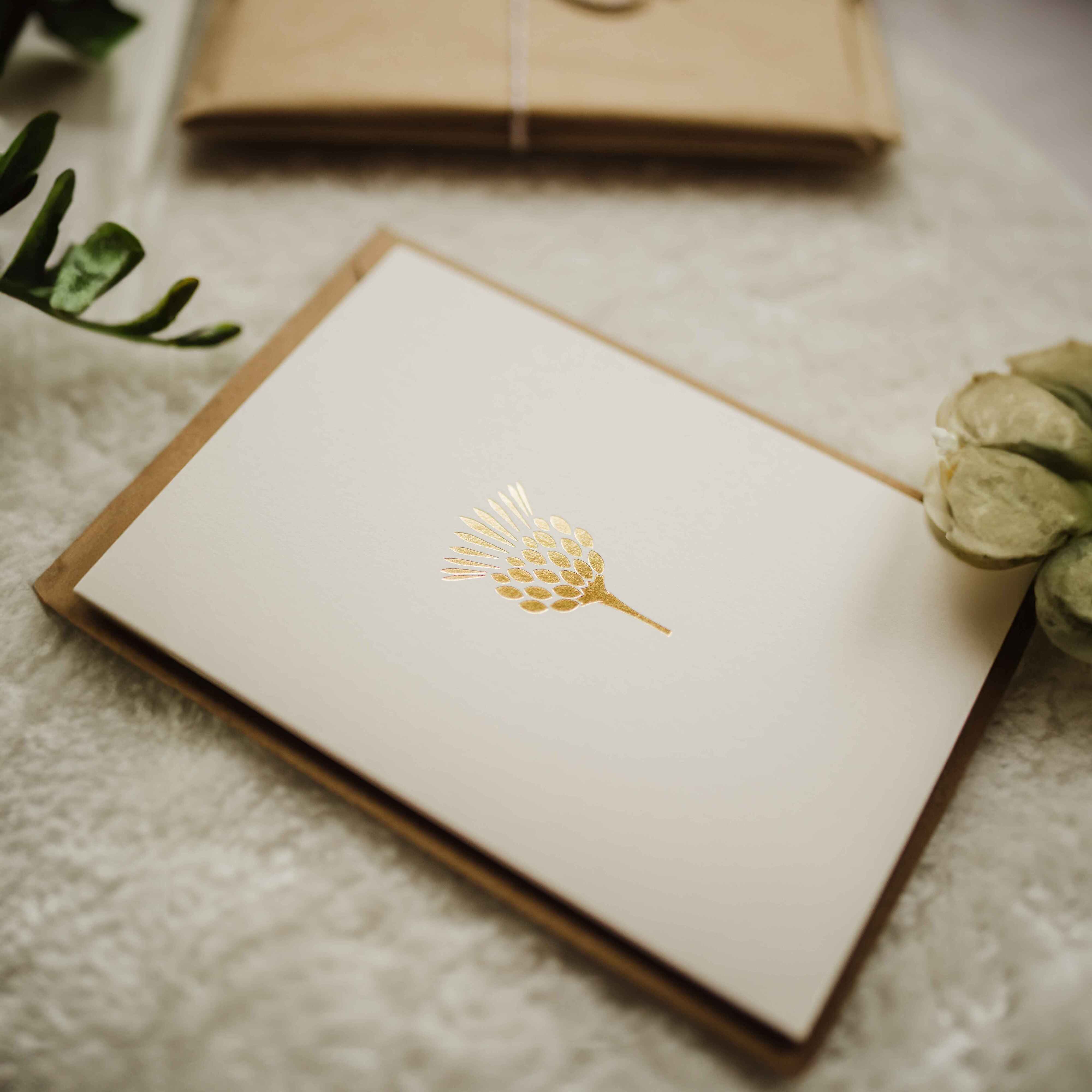 Cream card with gold thistle