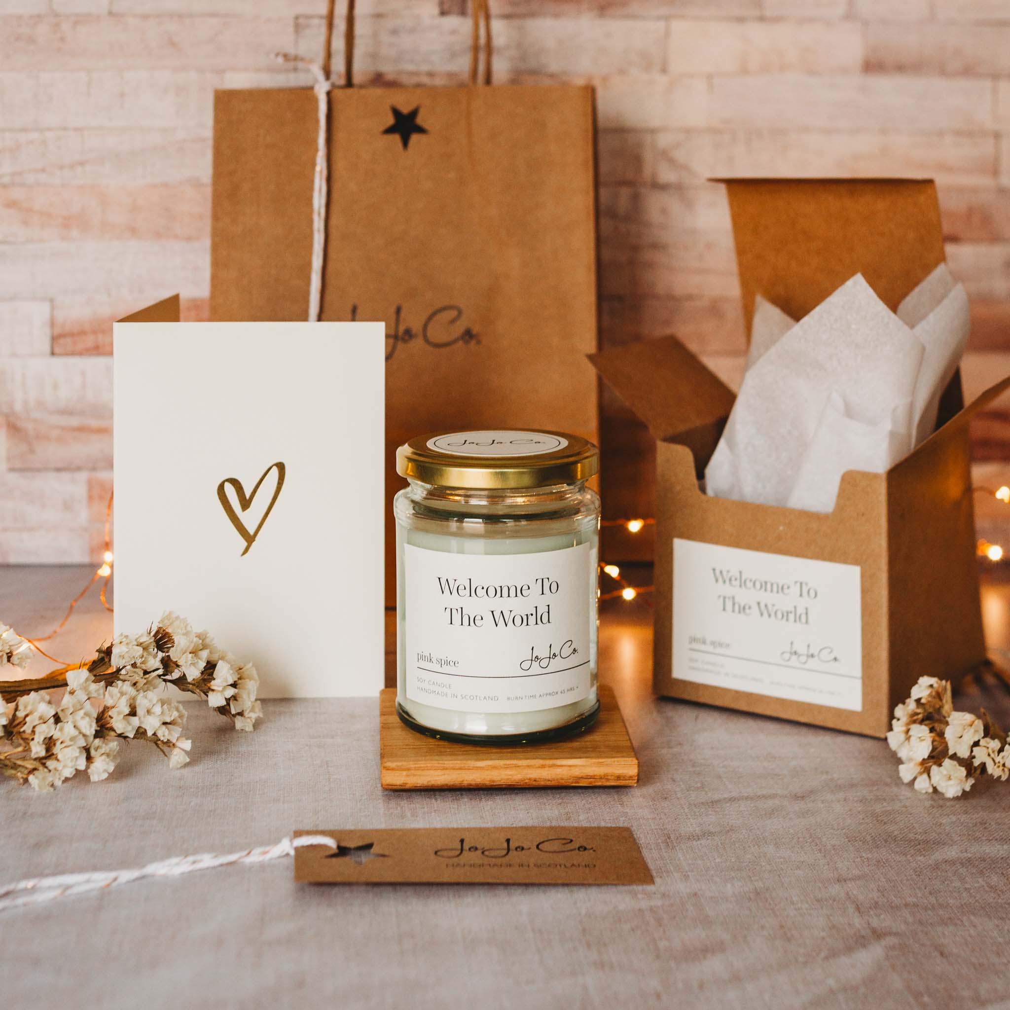 New Baby Candle Gift with Welcome To The World label, handmade luxury soy candle in gift box by JoJo Co, Scotland