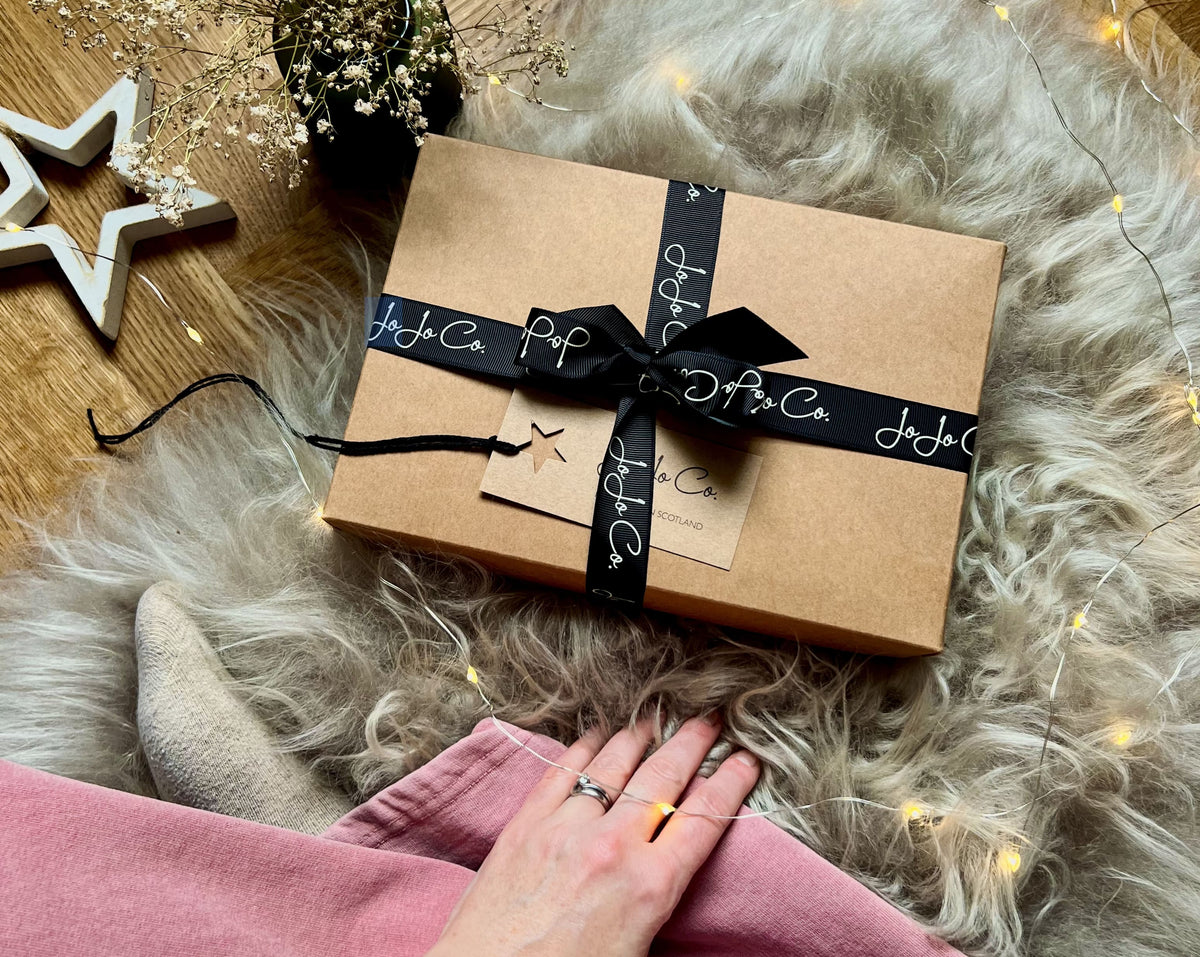 Beautifully wrapped Christmas gift with gift tag from JoJo Co. handmade in Scotland 