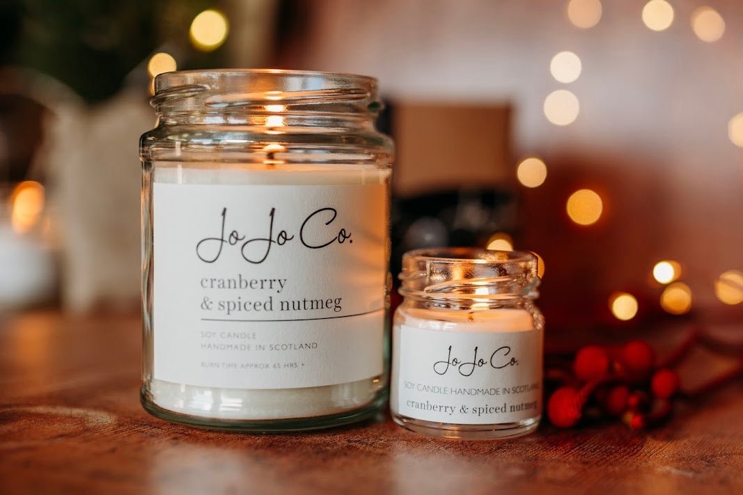 Winter Grace and Cranberry & Spiced Nutmeg handmade soy candles by JoJo Co., featuring cosy winter and festive home fragrances made in Scotland.